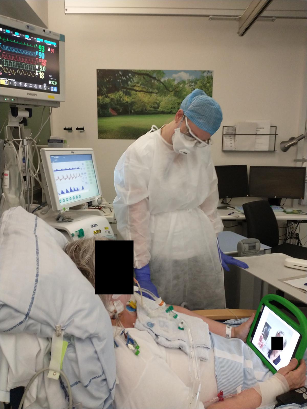 Patient making a video call in the intensive care unit.