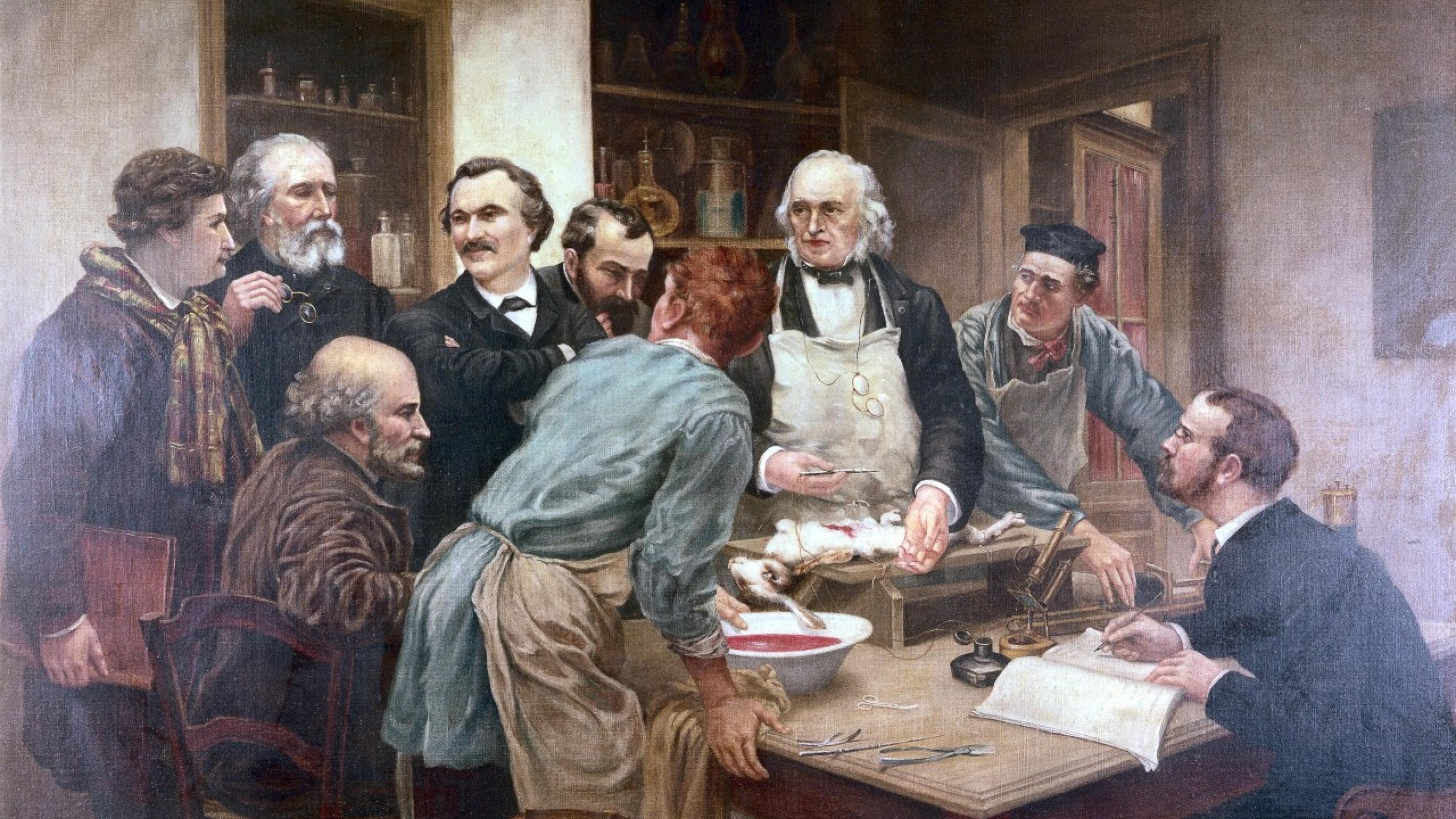 Den store franske fysiolog Claude Bernard eksperimenterer, mens hans elever ser beundrende til. Panum var assistent hos Bernard i begyndelsen af 1850’erne. Billedet er malet af Léon-Augustin Lhermitte (1844-1925) (Wellcome Collection)